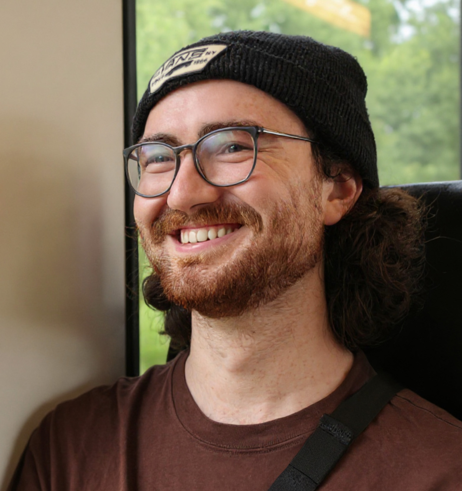 A portrait of Levin smiling at the camera